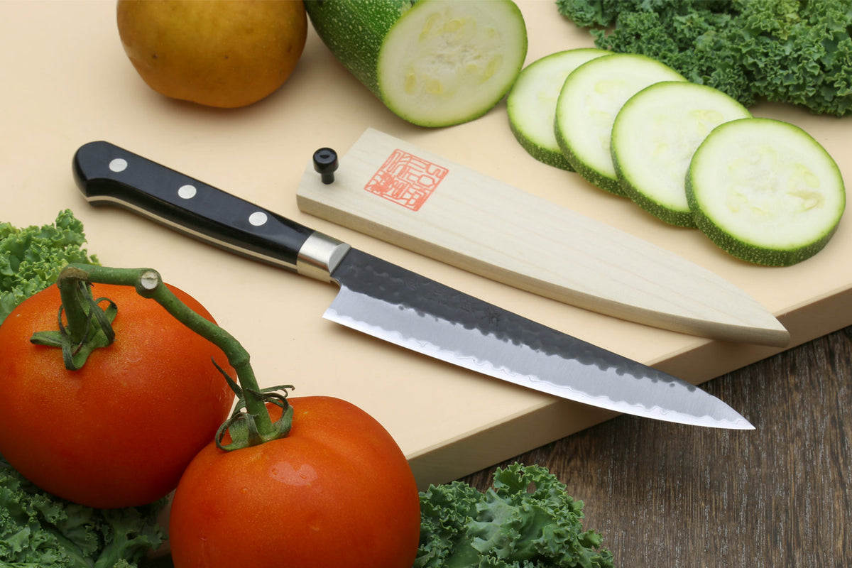 Slice your way through meal prep with the Kurouchi Chef Knife by