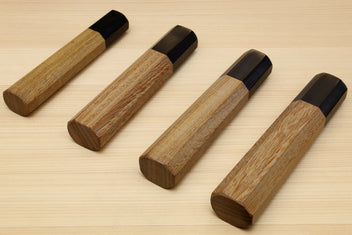 Wooden knife handles with dark ebony bolster caps, ambrosia wood, angled view, for Petty knives