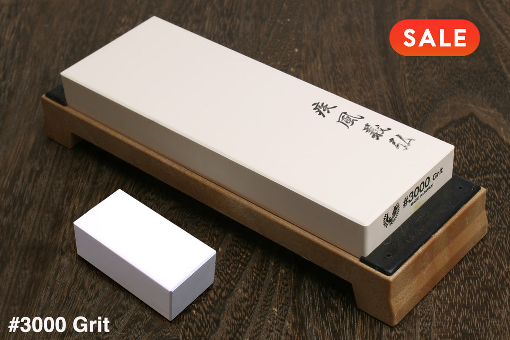 Sharpening stone with #3000 grit on a wooden surface, featuring a 'SALE' label.