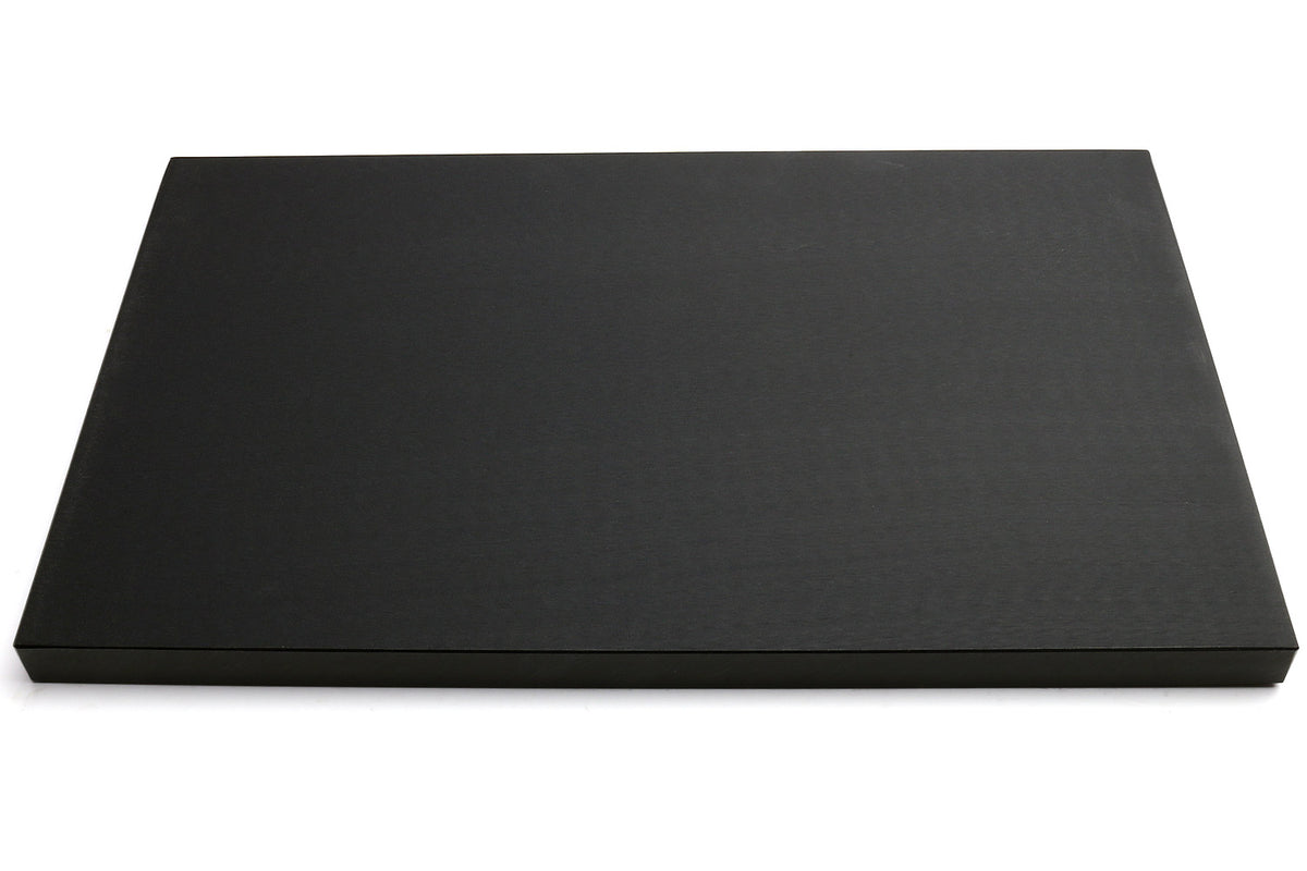 Black cutting board, smooth matte top surface, front view