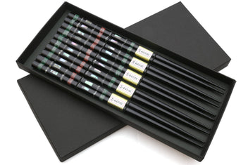 Black chopsticks set of 5 in open box, with green and red mosaic pattern
