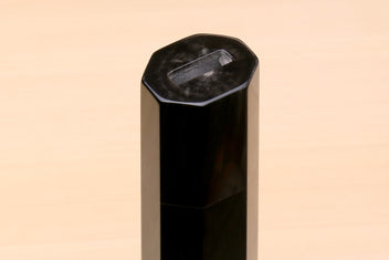 Horn bolster end on an ebony knife handle, faceted cut, for Sujihiki knives