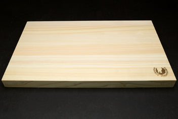 Japanese cypress cutting board side profile with Yoshihiro logo near corner