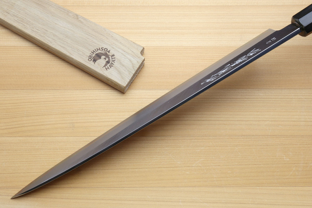 Yanagiba sashimi knife with dark handle, silver blade and engraved bolster area