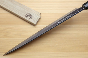 Yanagiba sashimi knife with dark handle, silver blade and engraved bolster area