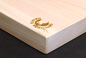 Hinoki cypress cutting board corner detail with engraved gold Yoshihiro Hinoki logo