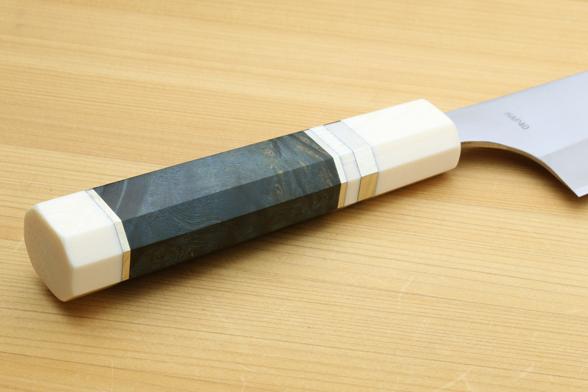 Octagonal ocean-blue handle with white bolster on gyuto chef's knife