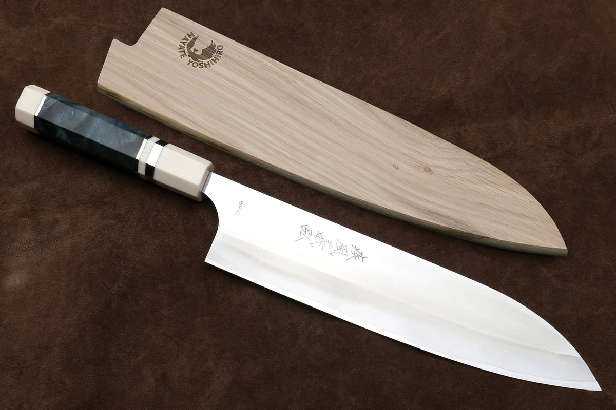 Yoshihiro HAP40 gyuto chef's knife with polished blade, blue octagonal handle, ivory bolster, and wooden sheath