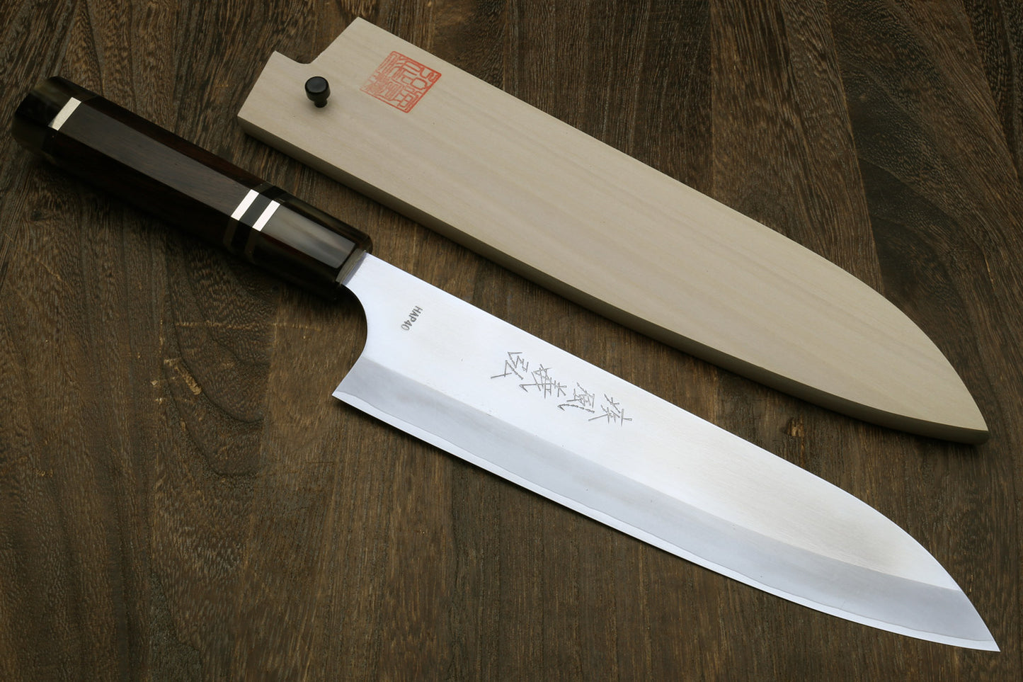 Yoshihiro High Speed Steel HAP40 Gyuto Chefs Knife with Triple Ring Ebony Handle with Magnolia Saya Cover