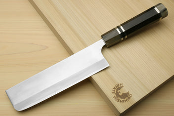 Nakiri vegetable chef knife with white blade and dark octagonal ebony handle, triple ring accents