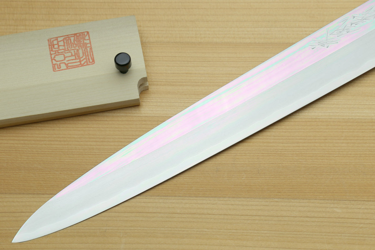 Left-handed yanagi slicing knife with long white steel blade and pale ivory bolster