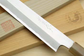 White steel yanagiba blade with etched markings and sharp edge detail