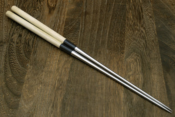 Sushi tweezers pair with light wood handles and stainless steel tips