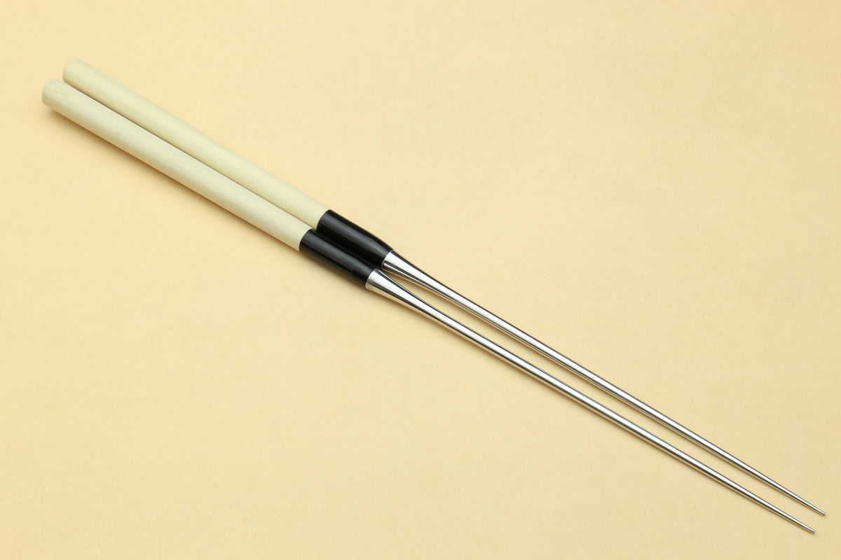 Single sushi plating tweezers with light wooden handle, black band, stainless tips