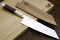 Kiritsuke chef knife with white stainless blade, rosewood handle, ivory-look bolster.