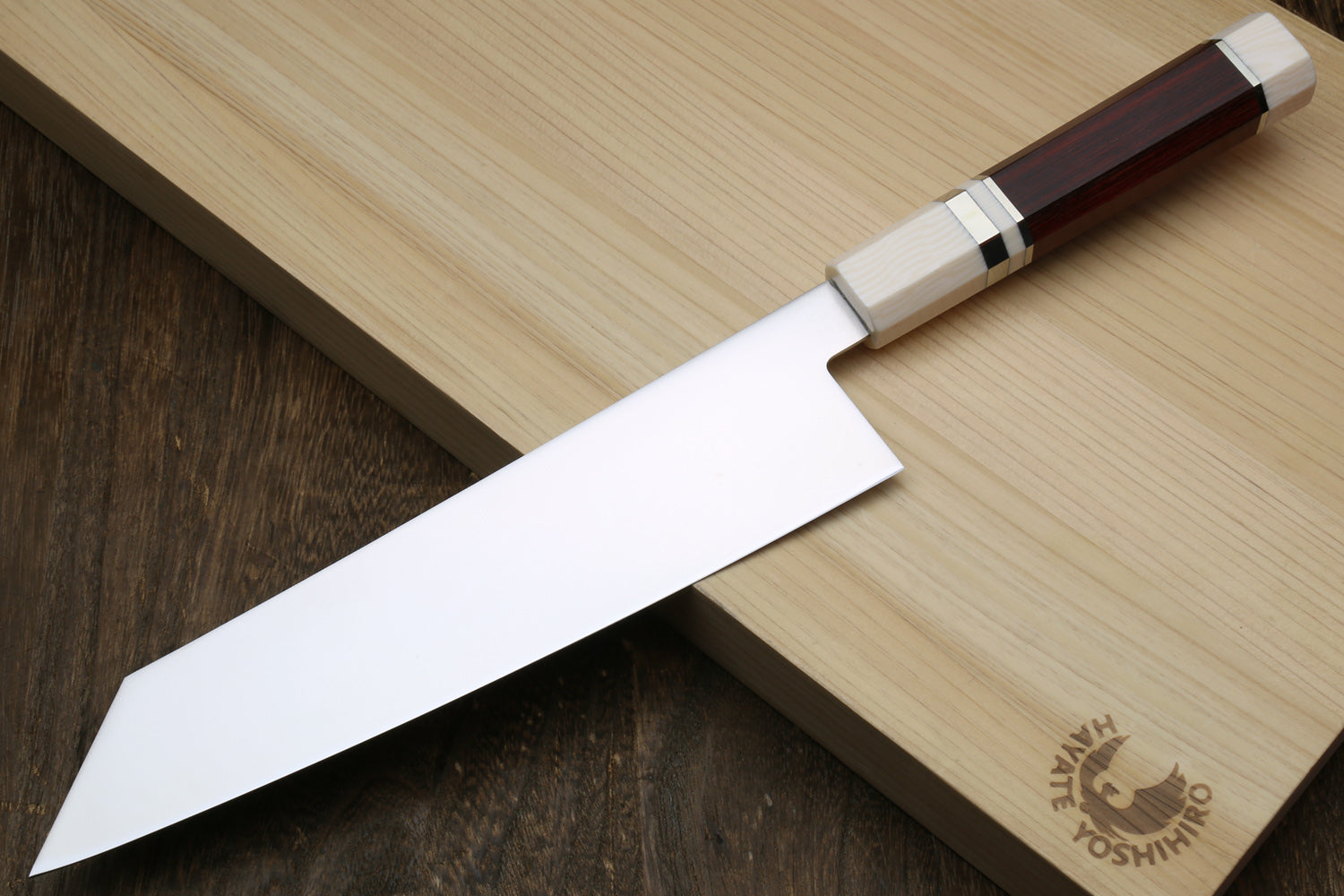 Kiritsuke chef knife, white blade with logo etching, rosewood handle and ivory-look bolster.