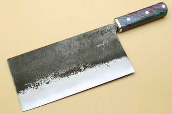 Chinese-style cleaver knife, wide dark mottled blade with iridescent purple-blue handle