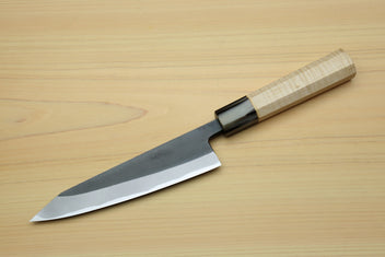 Kurouchi-finished blue steel petty knife with black bolster and light wood handle.