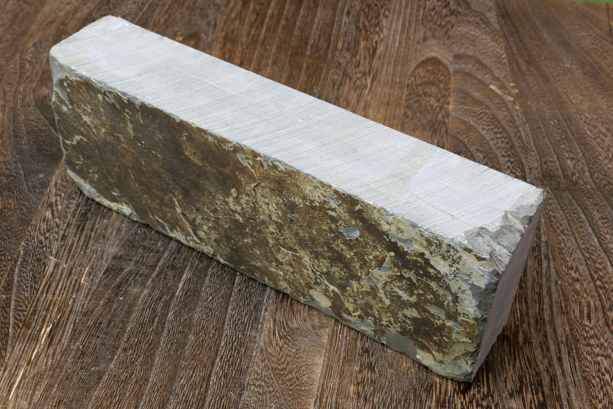 Natural sharpening whetstone rectangular block, speckled brown-gray face and pale side