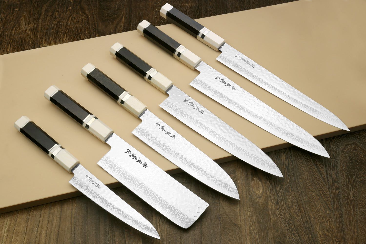 6 pc set of Knives on a plastic cutting board