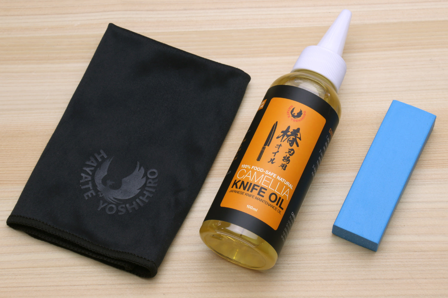 Yoshihiro Tsubaki Camellia Knife Oil Care Kit with bottle, microfiber cloth, and Sabitori rust eraser