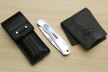 Polished stainless lockback folding pocket knife with leather sheath and cloth