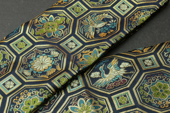 Knife pouch bag fabric detail with octagonal floral damask in blue, gold, and green