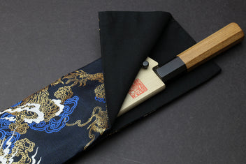 Black knife pouch bag with gold and blue dragon pattern, folded with snap closure flap