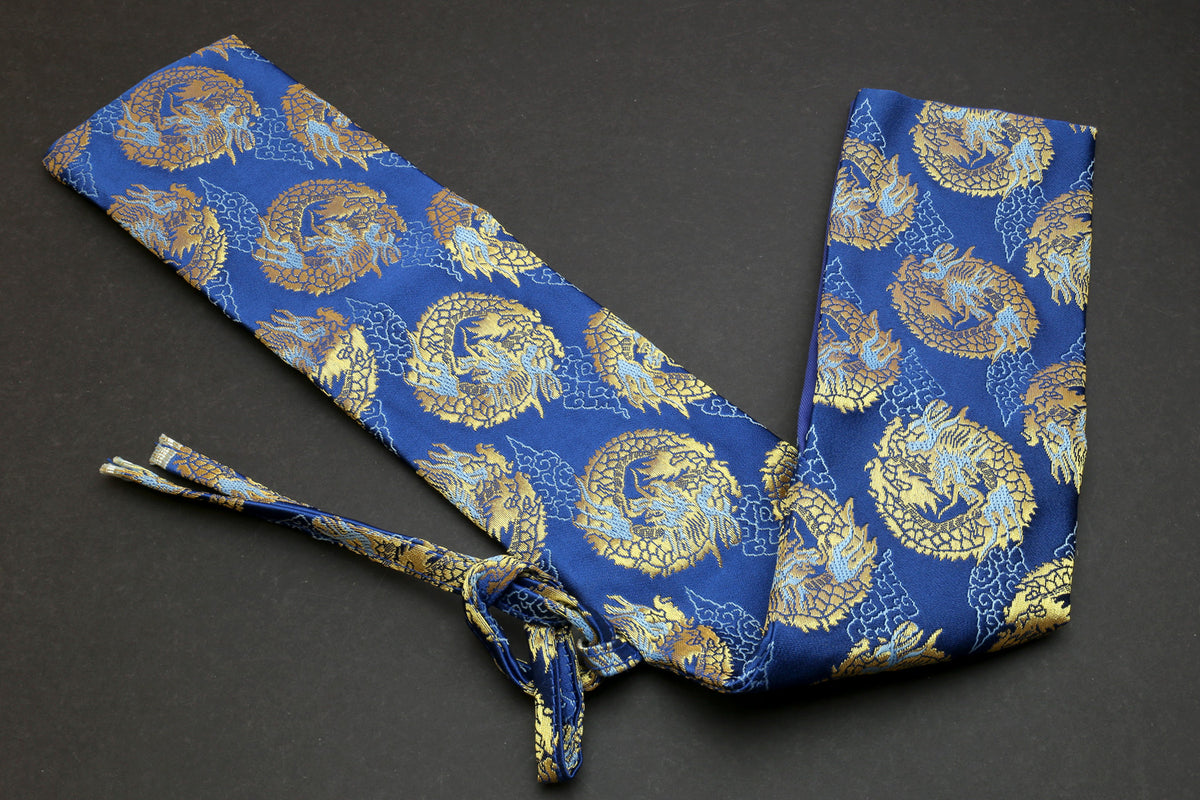 Blue knife pouch with gold dragon pattern, wrapped tie closure and folded fabric