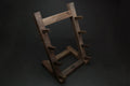 Ebony and rosewood knife rack stand with cutout frame and layered knife holding bars