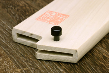Light wood wooden blade protector saya with recessed slots and black knob