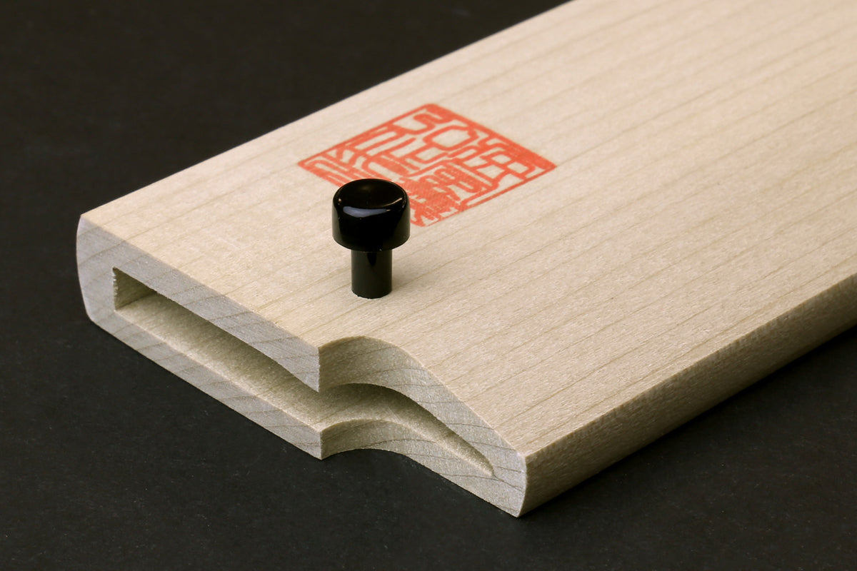 Wooden saya cover with open mouth and black rivet, pale natural magnolia