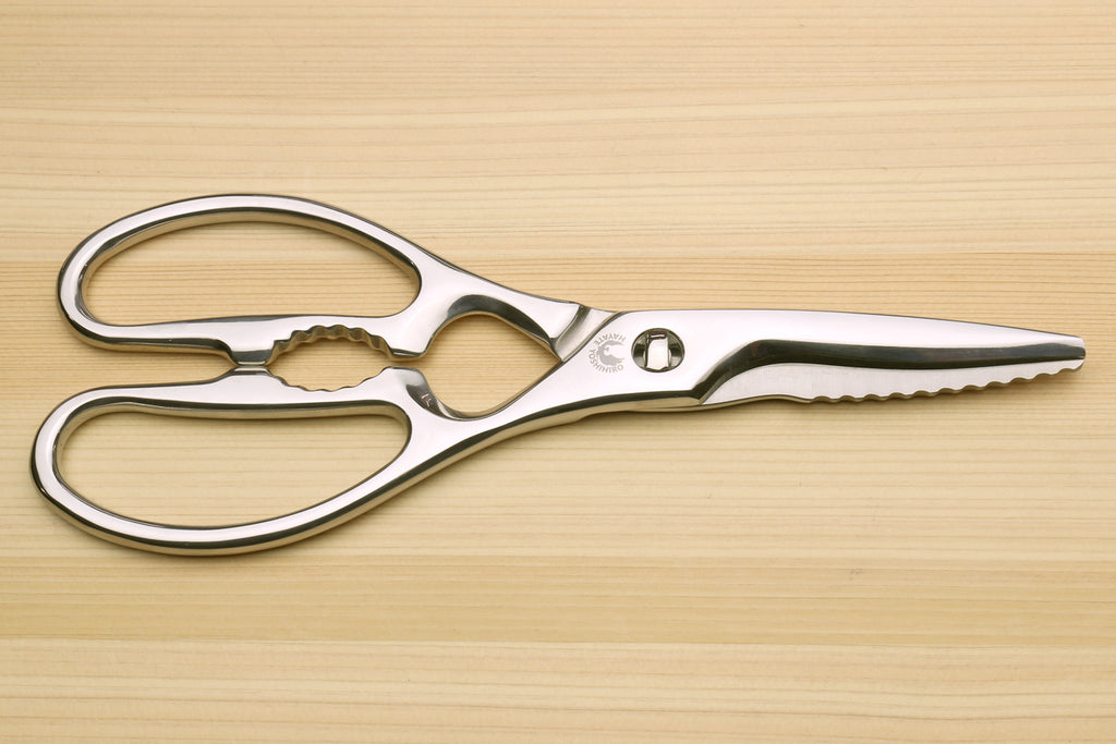 Stainless steel Japanese kitchen shears, serrated cutting edges and loop handles.