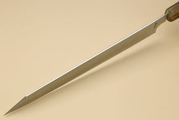 Long stainless slicer knife side view with pointed tip and wooden handle