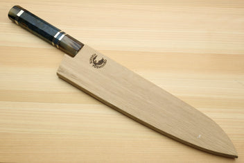 Gyuto chef knife with ocean blue handle and damascus blade on wooden board