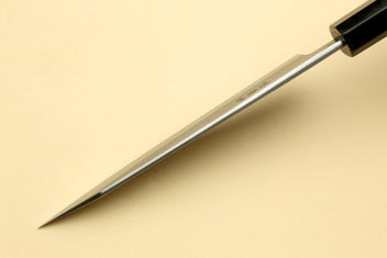 Petty-kiritsuke knife with long edge and ebony handle, tip facing down