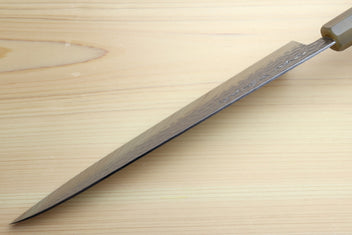 Gyuto chef knife side view with dark edge and green stabilised handle