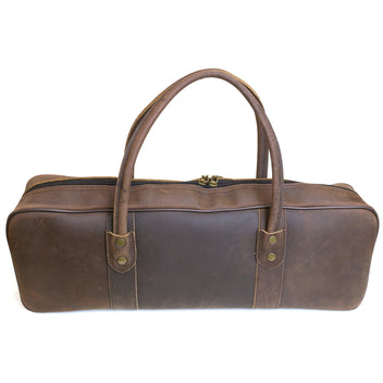 Brown leather knife bag with two top handles and stitched center panels