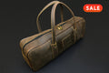Brown leather knife bag with a 'SALE' label on a dark background