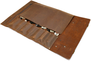 Brown leather knife roll case open with knives in interior pockets and large flap