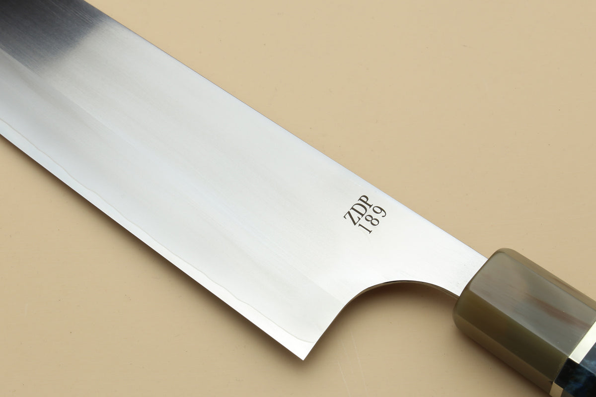 Gyuto chef's knife blade close-up marked ZDP 189