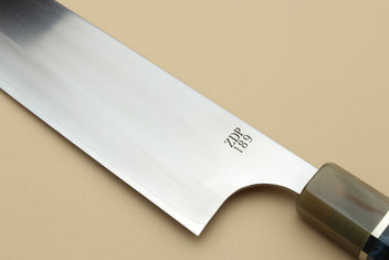 Gyuto chef's knife blade close-up marked ZDP 189