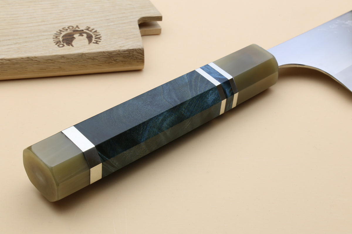 Gyuto chef's knife handle close-up with dark blue scales and three metal rings