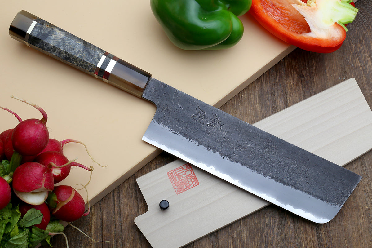 Nakiri vegetable knife with wide blade, visible tang stamp, and blue-gray patterned handle