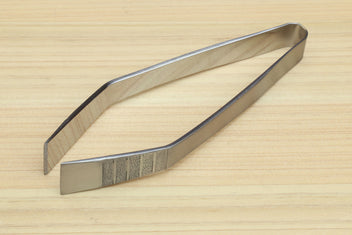 Non-slip fish bone tweezers with tapered tips and textured center grip.