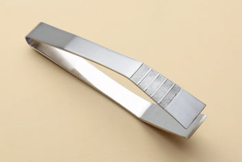 Non-slip fish bone tweezers with textured center grip and stainless steel finish.