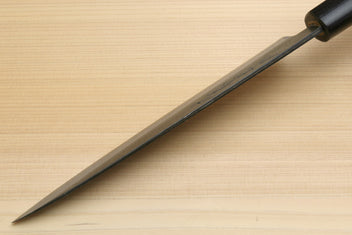 Petty knife side view with blue steel blade and dark wood handle
