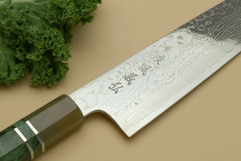 Damascus gyuto knife with wavy blade pattern and dark green handle with brass bolster