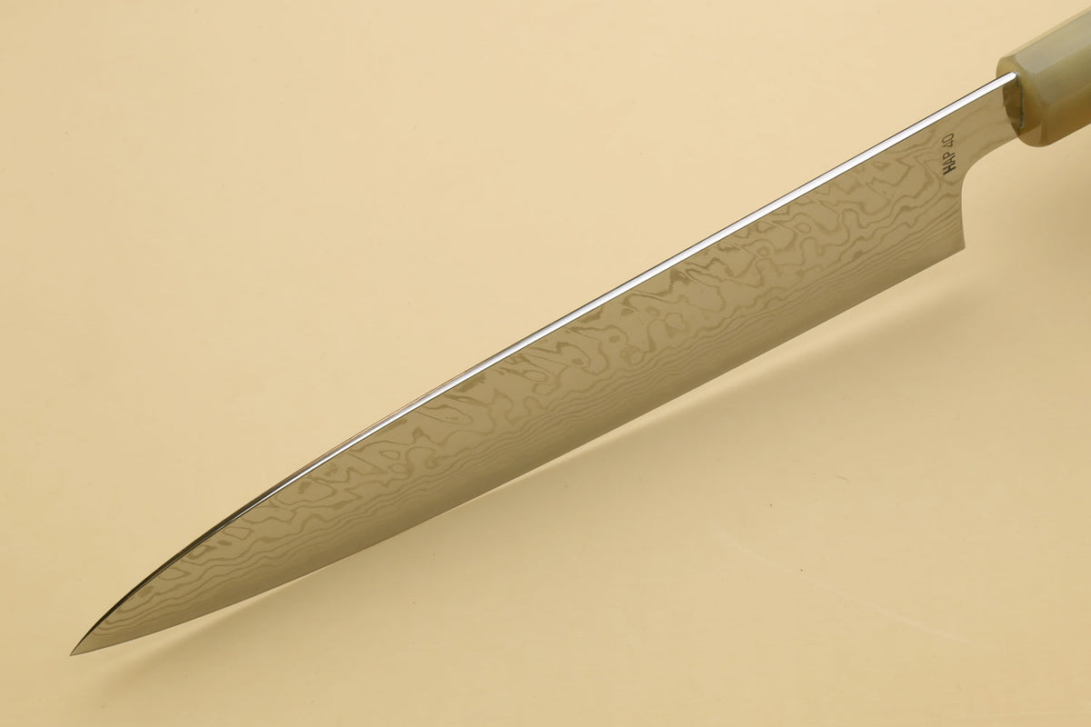 Damascus gyuto chef knife blade side view with wavy Damascus pattern