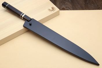 Sujihiki slicer knife with long dark blade, black handle, and triple nickel ring